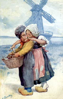 Dutch_boy_and_girl_in_front_of_windmill
