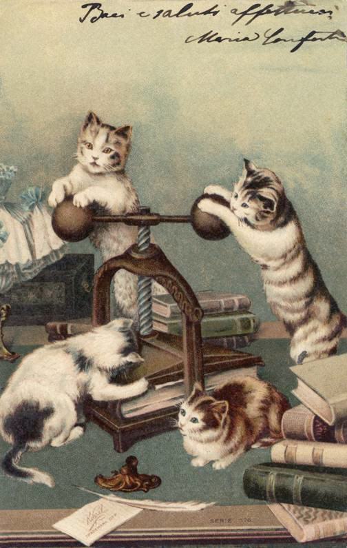 Kittens "working" with (book) Press.